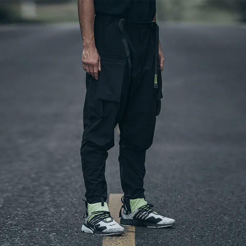New men's black casual pants with loose fit and pockets on a model