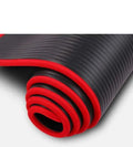 10mm thick black NBR yoga mat measuring 60 by 181 centimetres on a floor
