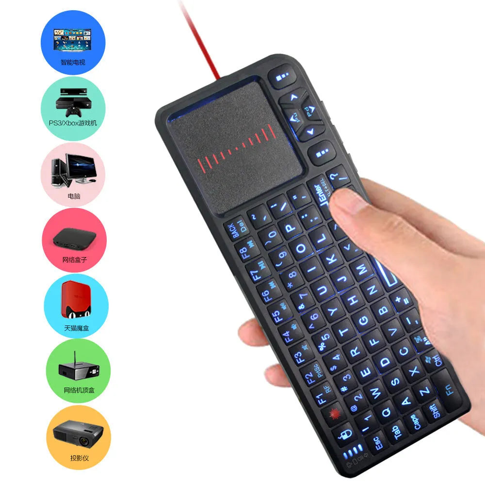 Black wireless laser teaching mini keyboard with touch screen on a desk