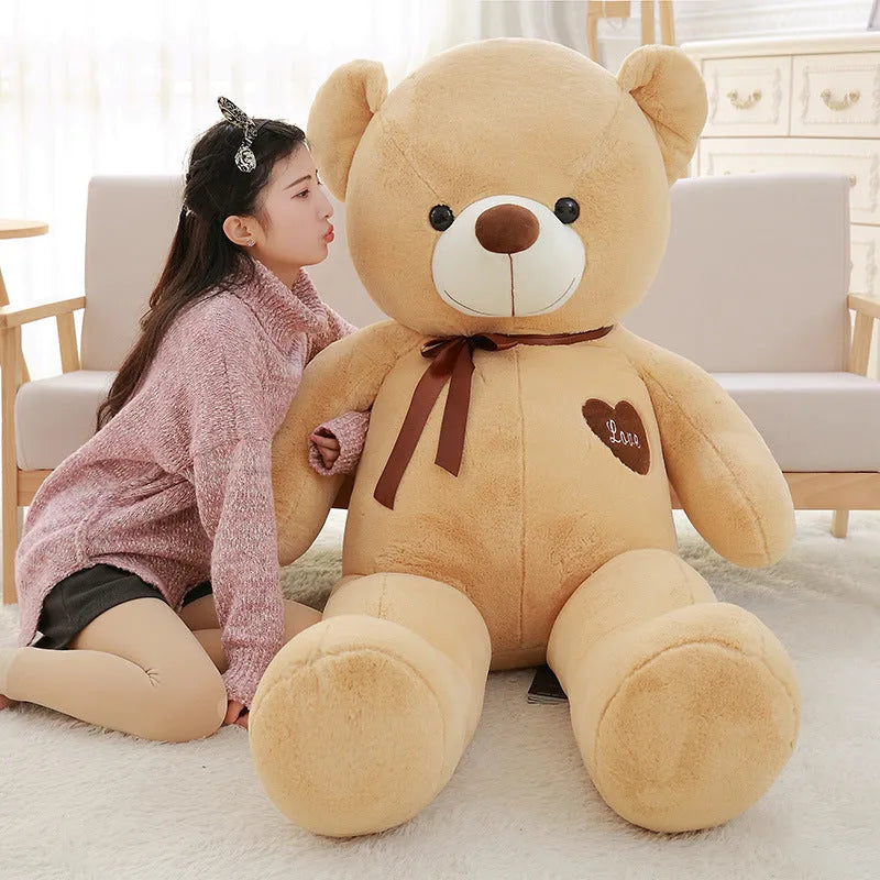 Large plush teddy bear doll with ribbon details in light brown, pink, white, khaki or dark brown colours