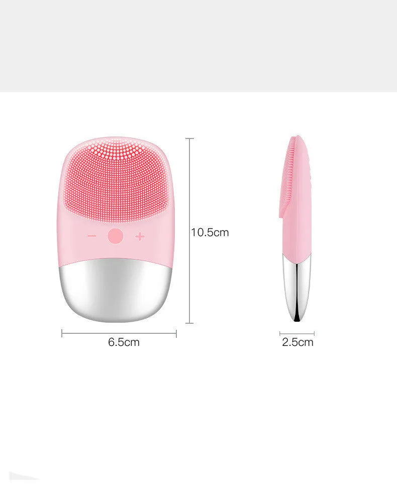 Mini pink silicone electric face cleansing brush with sonic vibration and USB charging on a white background