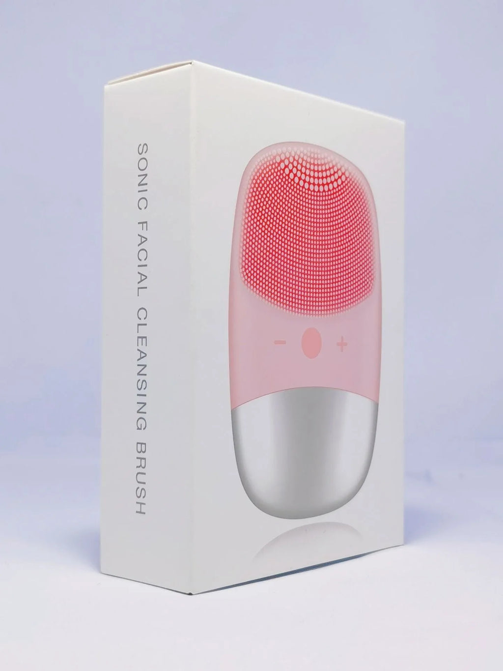 Mini pink silicone electric face cleansing brush with sonic vibration and USB charging on a white background
