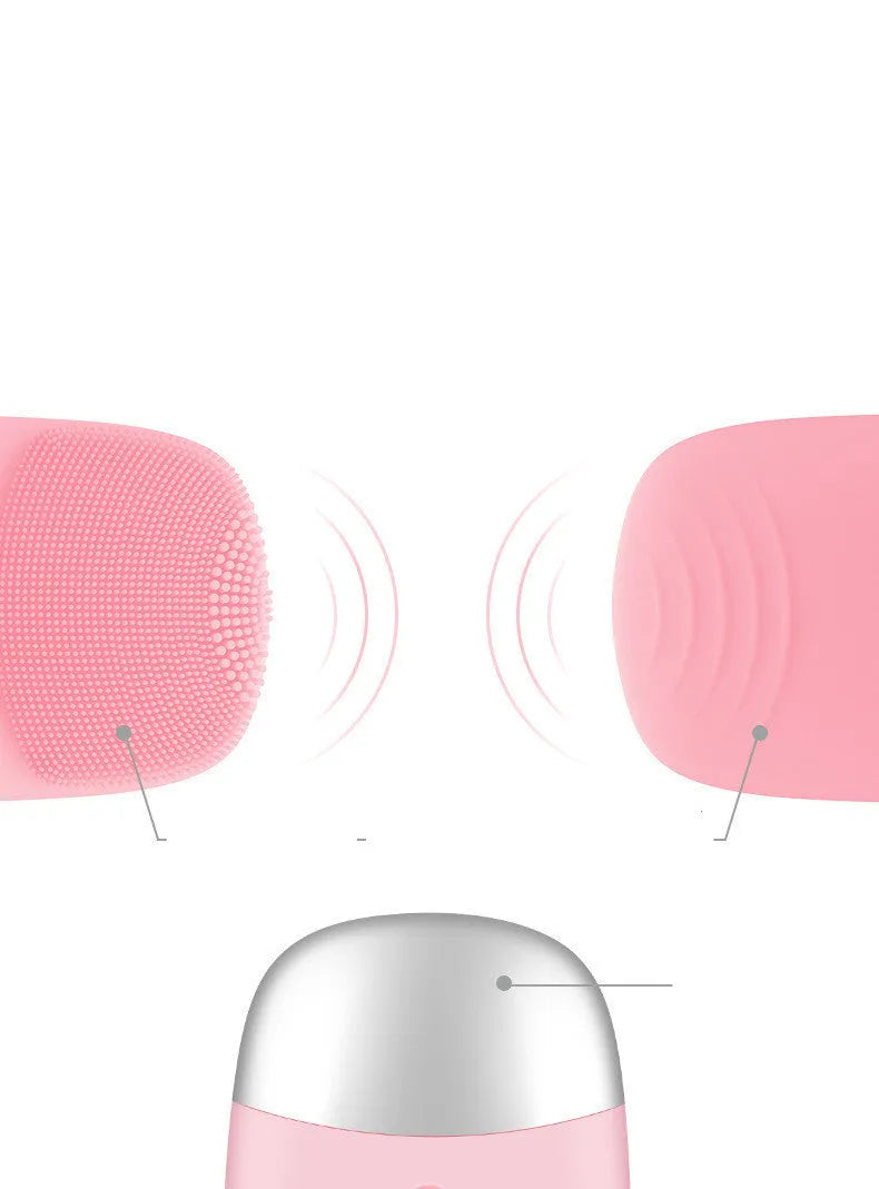 Mini pink silicone electric face cleansing brush with sonic vibration and USB charging on a white background