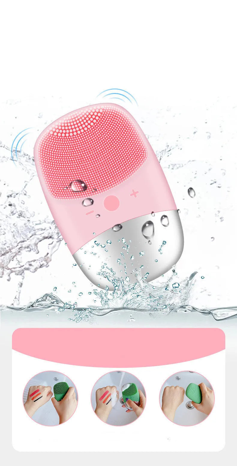 Mini pink silicone electric face cleansing brush with sonic vibration and USB charging on a white background