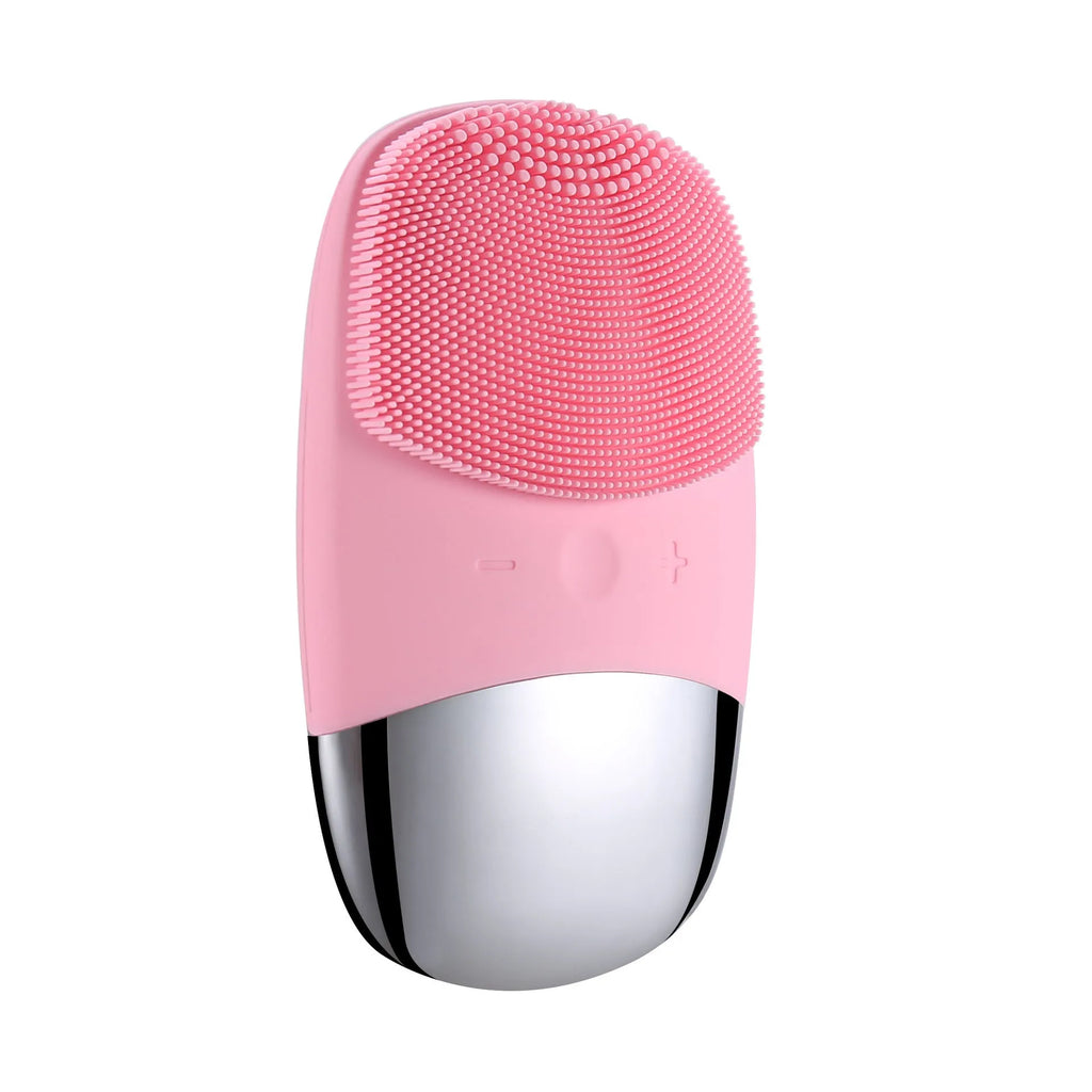 Mini pink silicone electric face cleansing brush with sonic vibration and USB charging on a white background