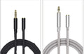 Black nylon braided 3.5mm aux extension cable coiled on a surface, 1.5 metre length