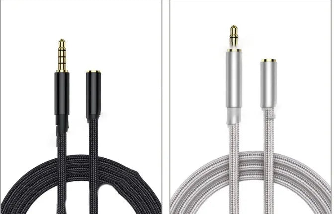 Black nylon braided 3.5mm aux extension cable coiled on a surface, 1.5 metre length
