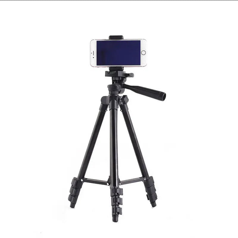 Black aluminium camera tripod with 4-section legs extended, 3D head, and quick-release plate.