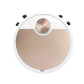 Golden robotic vacuum cleaner with remote control on a home floor