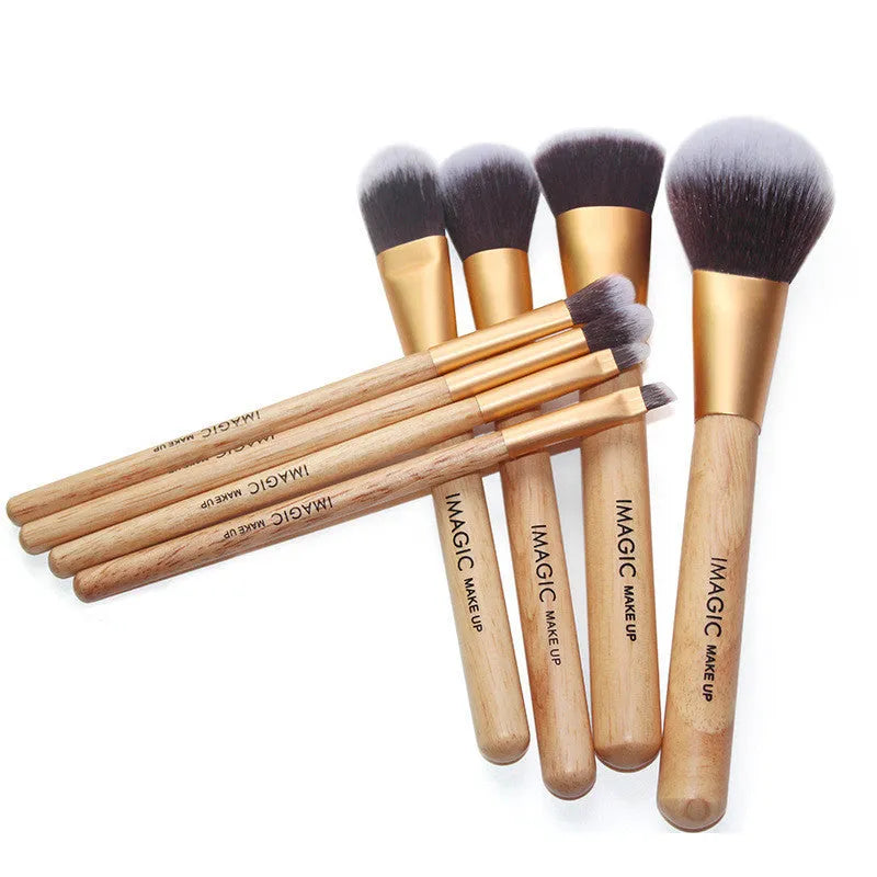 Eight-piece makeup brush set including foundation, blush, powder, eyeshadow, and highlighter brushes in assorted colours.
