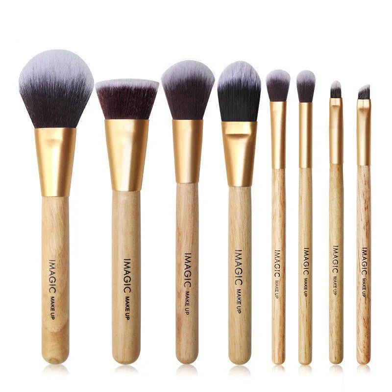 Eight-piece makeup brush set including foundation, blush, powder, eyeshadow, and highlighter brushes in assorted colours.
