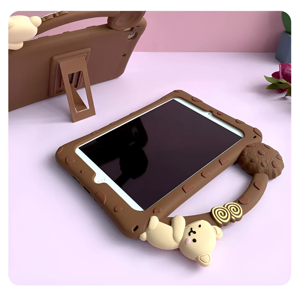 Brown cartoon-style silicone sleeve with a folding stand for an iPad tablet on a wooden table.