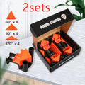 Four plastic 90-degree right-angle woodworking clamps for picture frame assembly.