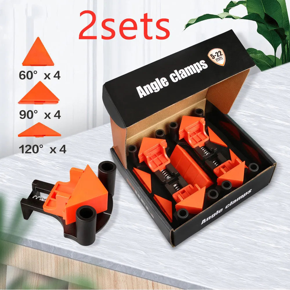 Four plastic 90-degree right-angle woodworking clamps for picture frame assembly.