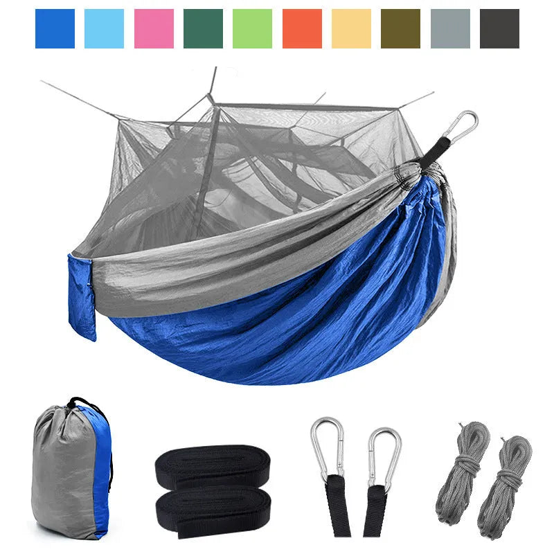 Blue camping hammock with mosquito net and sling ropes for outdoor use