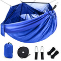 Blue camping hammock with mosquito net and sling ropes for outdoor use