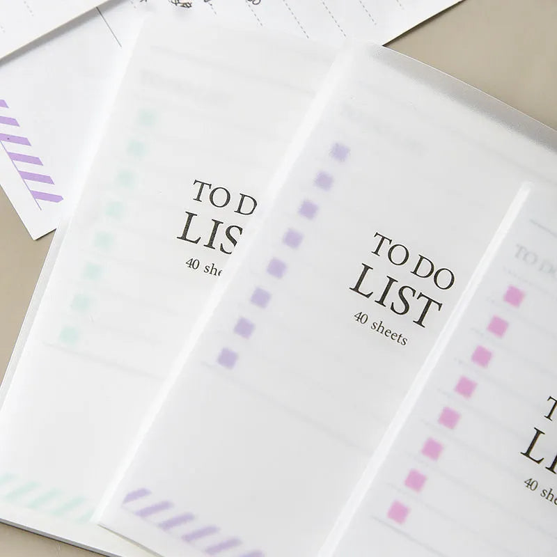 Yellow, green, and purple frosted PP cover notebooks showing 13 by 8 cm size and tearable pages.