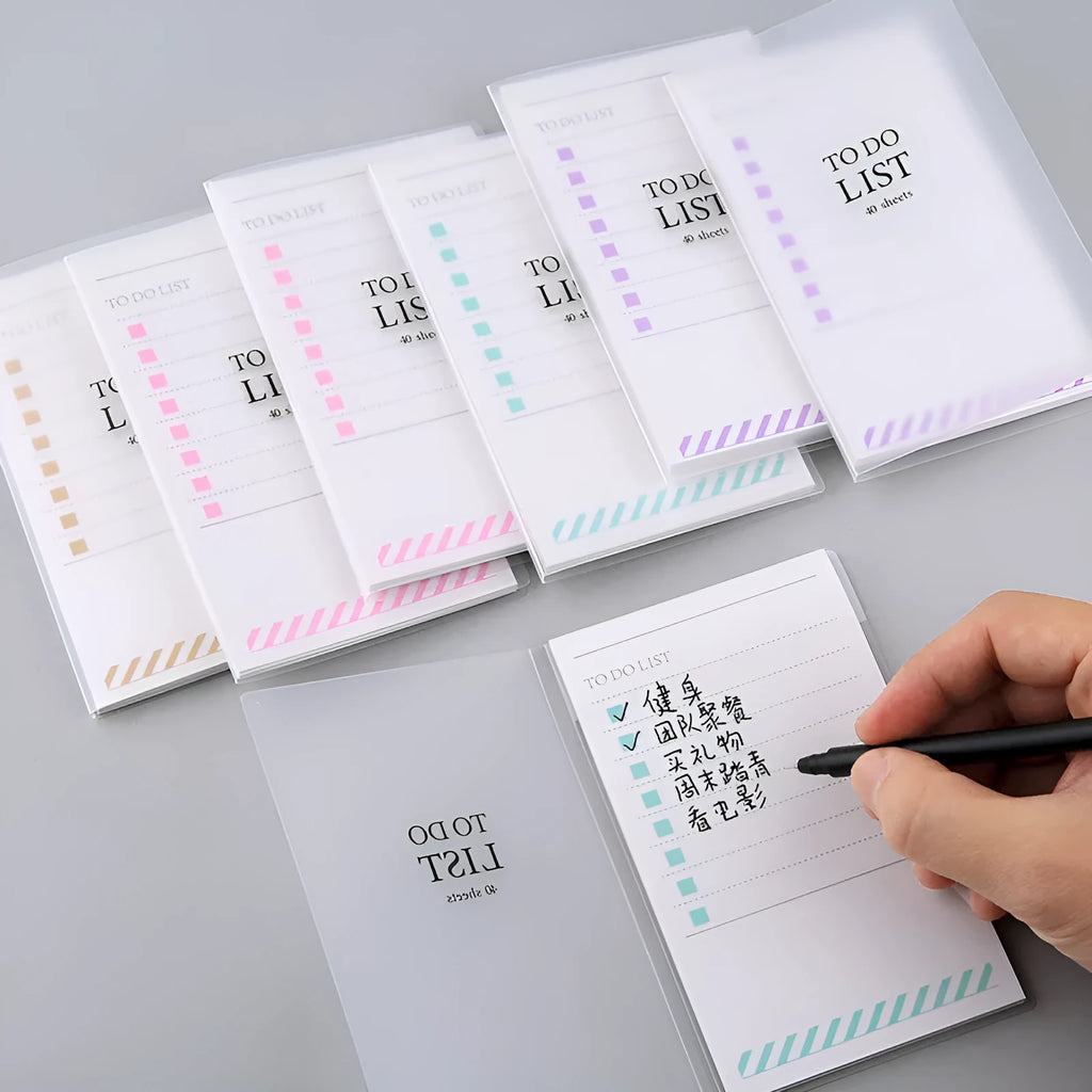 Yellow, green, and purple frosted PP cover notebooks showing 13 by 8 cm size and tearable pages.