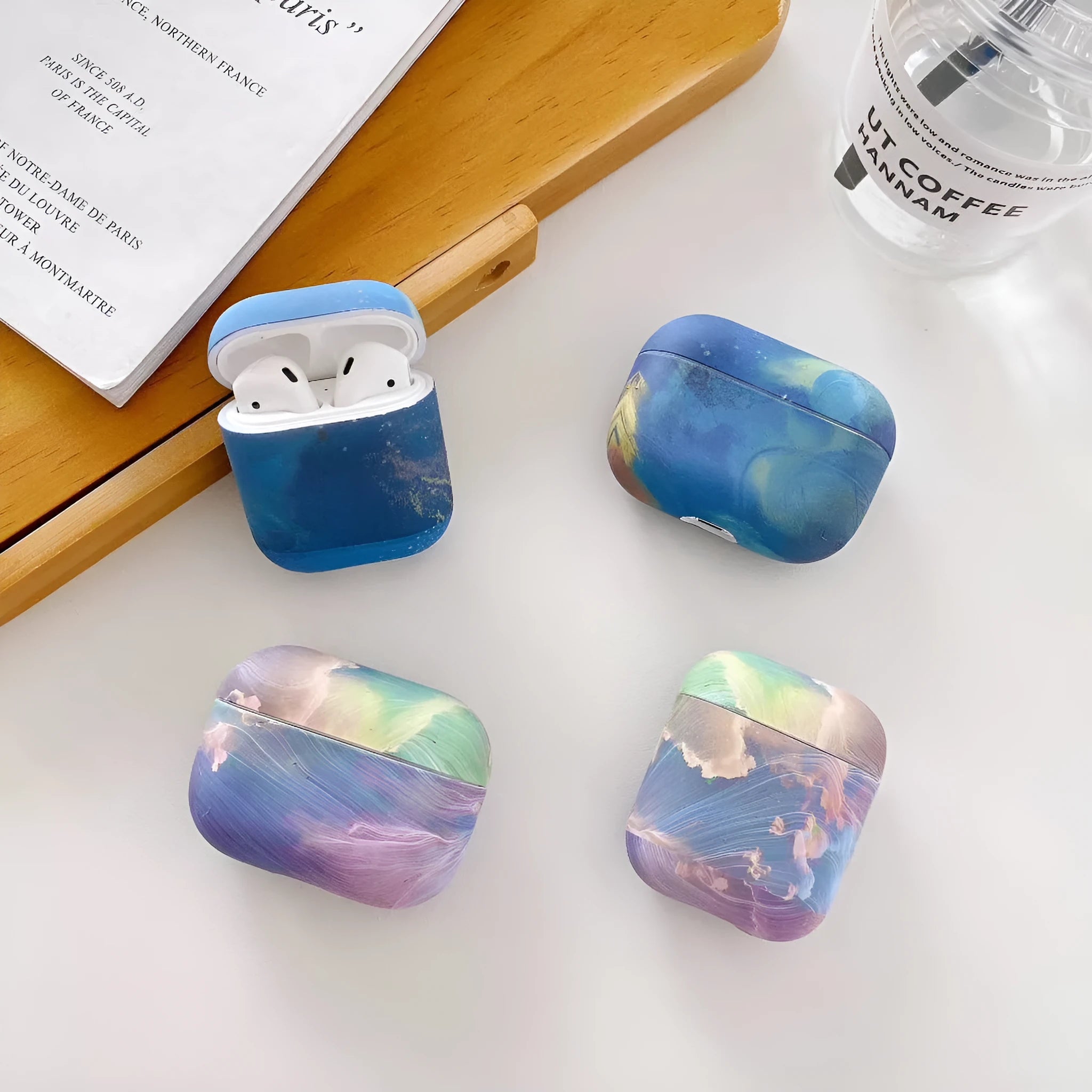 Pink and blue watercolour plastic protective sleeves for Apple AirPods Pro and AirPods 1/2 hard shell cases.