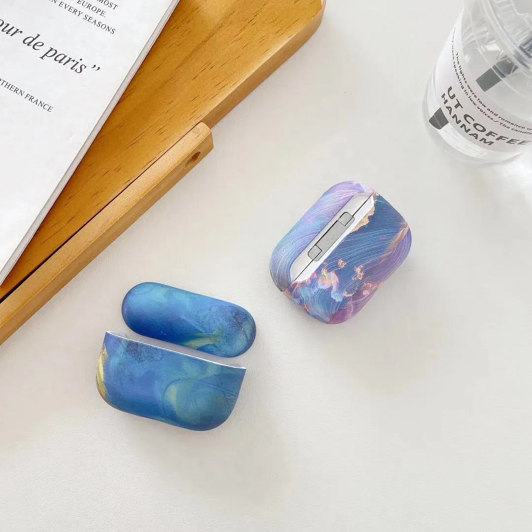 Pink and blue watercolour plastic protective sleeves for Apple AirPods Pro and AirPods 1/2 hard shell cases.