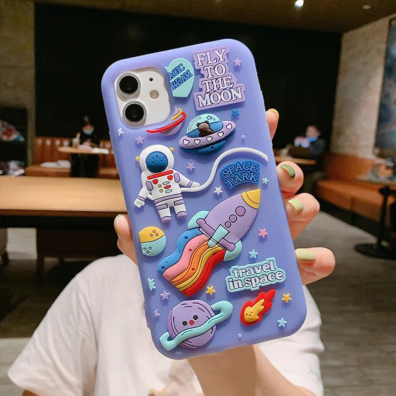 Purple silicone iPhone case featuring astronaut cartoon design for multiple model compatibility