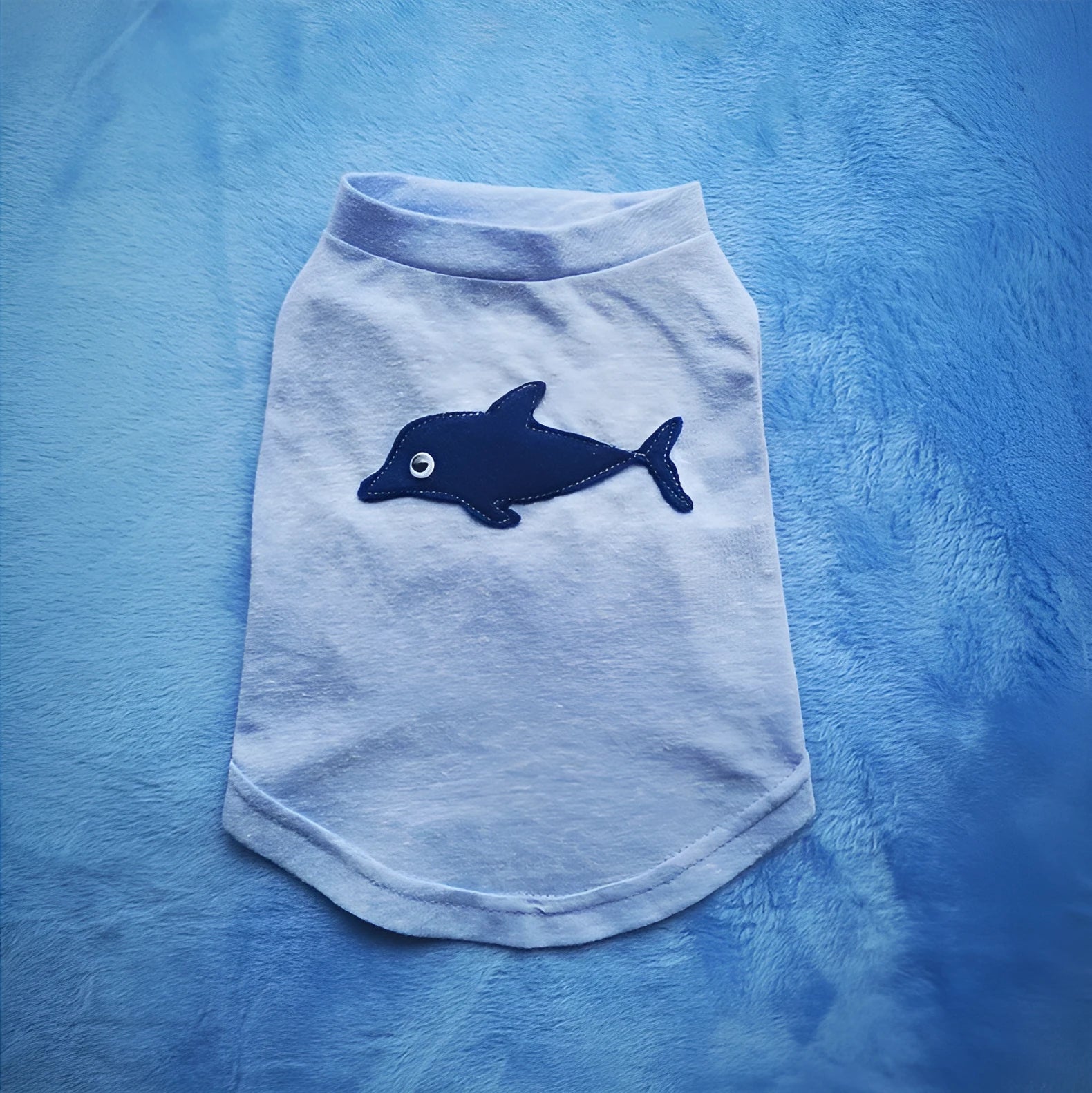 Dark blue cotton dog vest on a small dog with breathable fabric and slip-on design