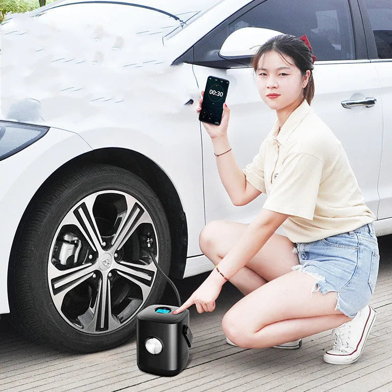 Portable car mini tyre air pump with digital display, black ABS body, 10.5cm diameter, next to car tyre