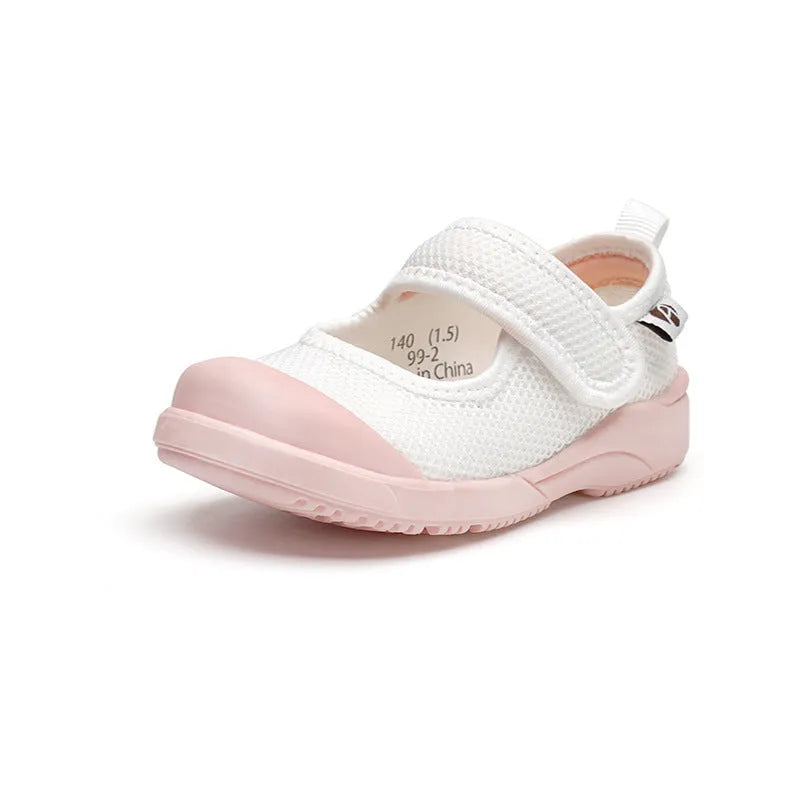 White children's cloth shoes with a breathable mesh upper and a Velcro strap fastening.