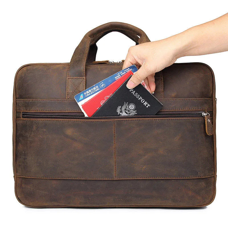 Men's dark brown Crazy Horse leather laptop bag with double handles and zip closure on a neutral background