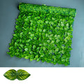 Plastic artificial fence panel with green colour-printed leaf design in a garden setting