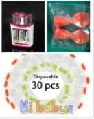 Baby food maker squeeze station pressing homemade fruit puree into 4oz pouch on countertop