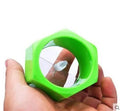 Yellow and green manual spiral vegetable cutter kitchen tool on a kitchen counter