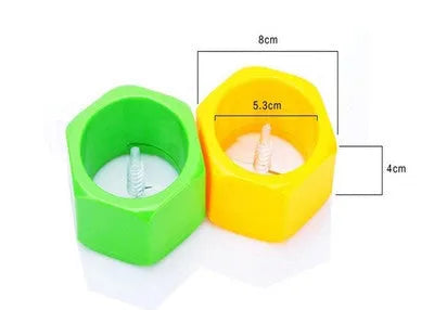 Yellow and green manual spiral vegetable cutter kitchen tool on a kitchen counter