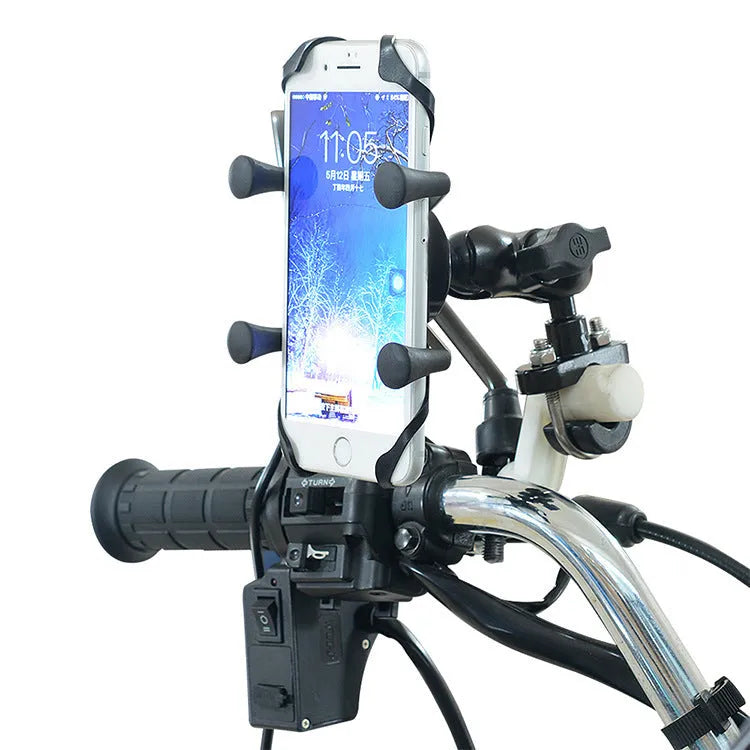 Black aluminium alloy motorcycle phone mounting bracket on a bicycle handlebar, holding a smartphone.