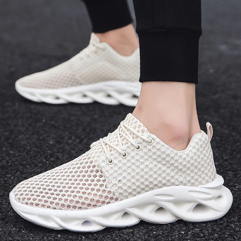 Men's hollow mesh breathable casual sneakers in beige, showing side view with lace-up closure and rubber sole.