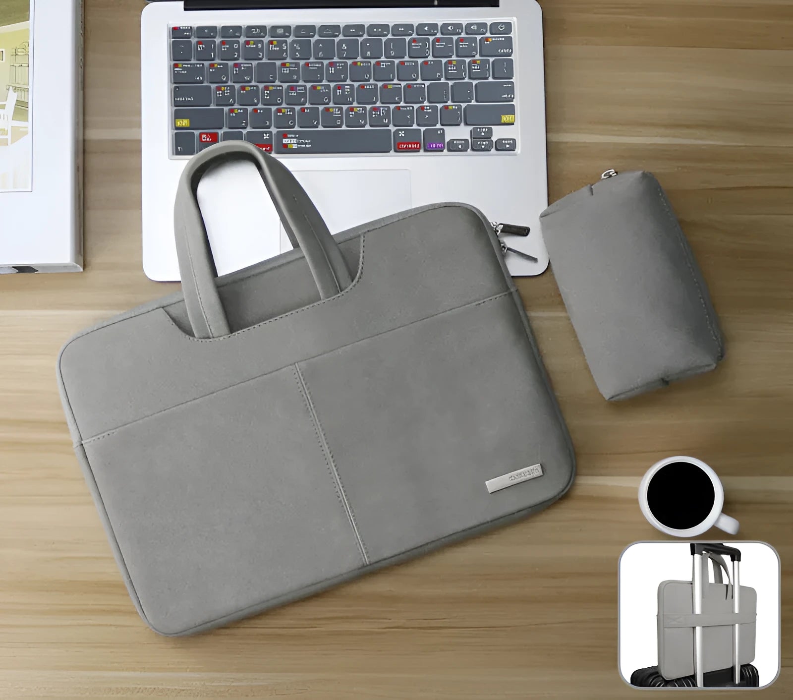 Dark grey PU leather laptop bag open to show padded compartment and internal organiser pockets.