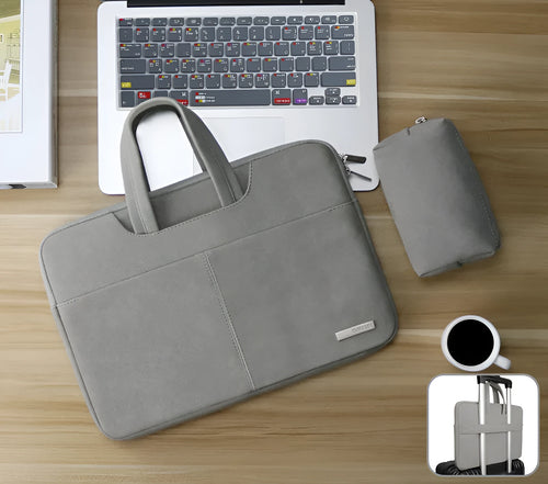 Dark grey PU leather laptop bag open to show padded compartment and internal organiser pockets.