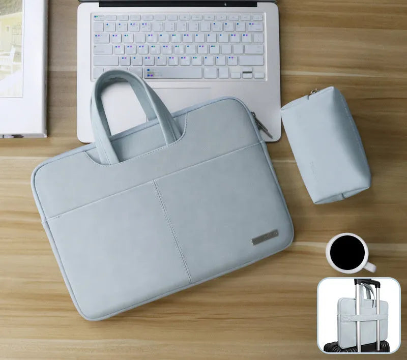 Dark grey PU leather laptop bag open to show padded compartment and internal organiser pockets.