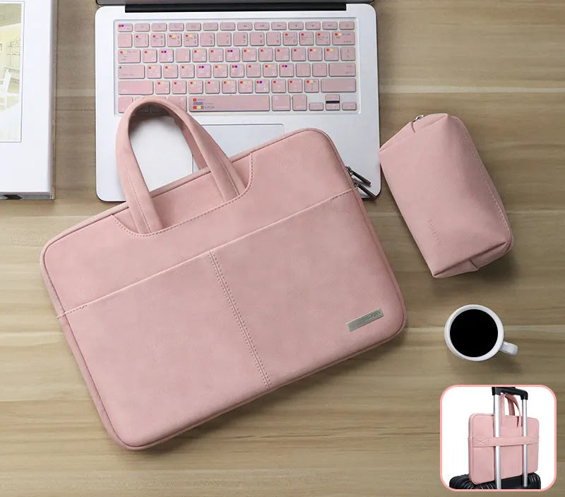 Dark grey PU leather laptop bag open to show padded compartment and internal organiser pockets.