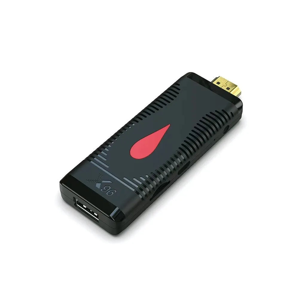Compact black TV stick dongle set-top box with remote control, HDMI cable, and power supply.