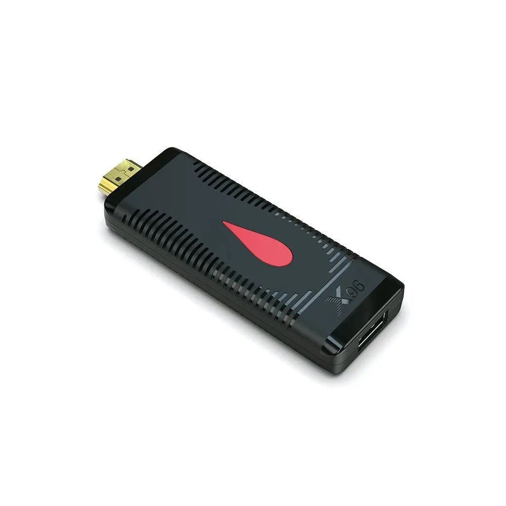 Compact black TV stick dongle set-top box with remote control, HDMI cable, and power supply.