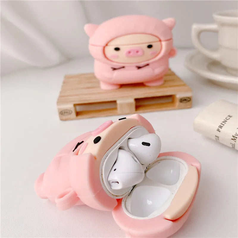 Pink silicone AirPods case cover with cartoon pig design and a metal carry hook.