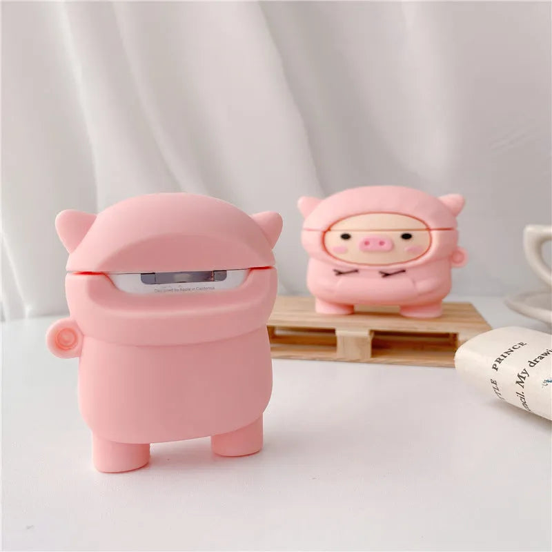 Pink silicone AirPods case cover with cartoon pig design and a metal carry hook.