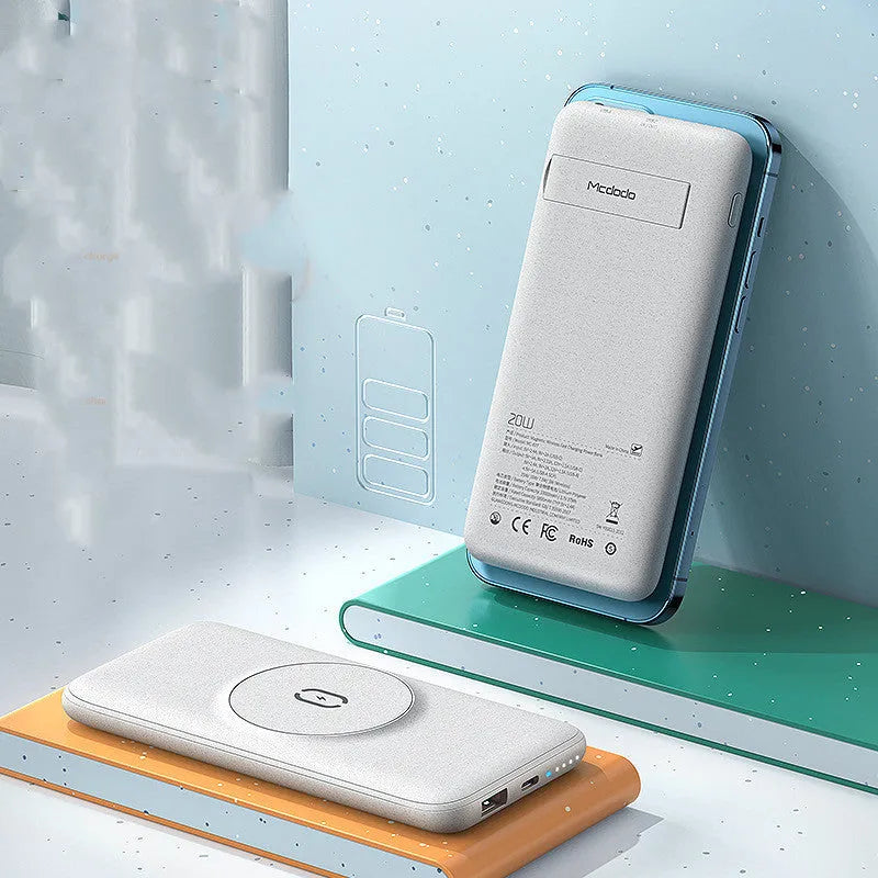 Mint green Maiduo Magsafe magnetic power bank clipped to the back of an iPhone