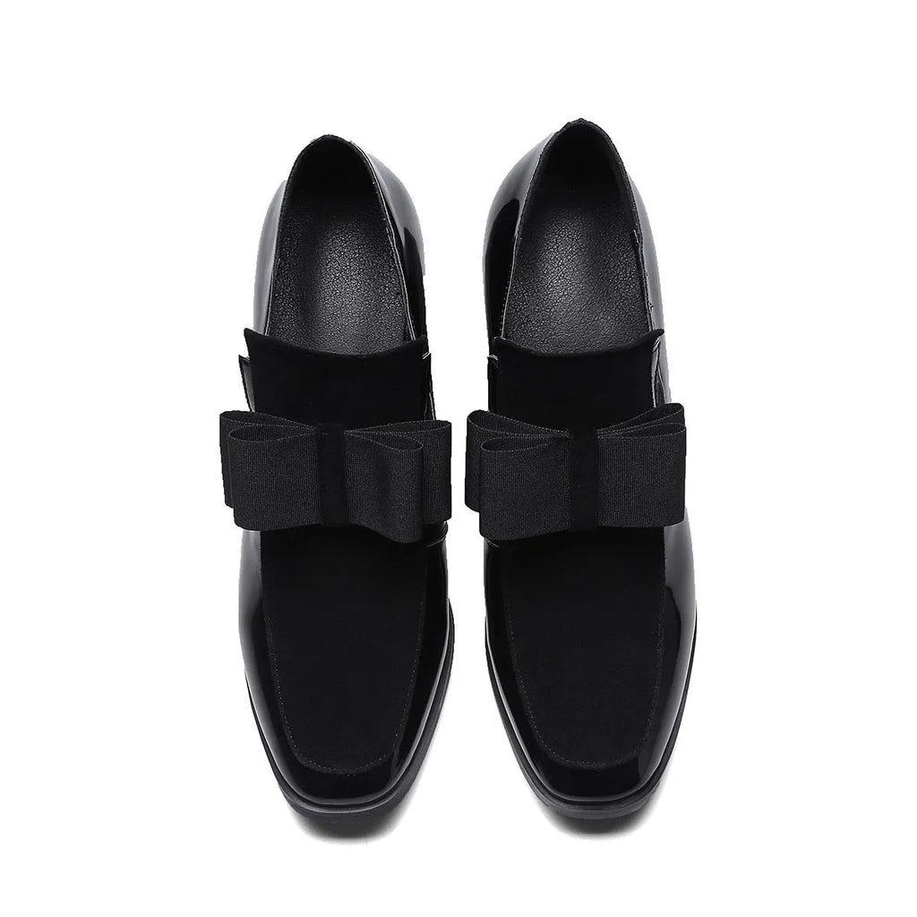 Black patent leather women's high heel shoes with a thick heel and square toe on a rubber sole