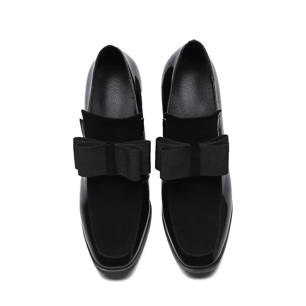 Black patent leather women's high heel shoes with a thick heel and square toe on a rubber sole