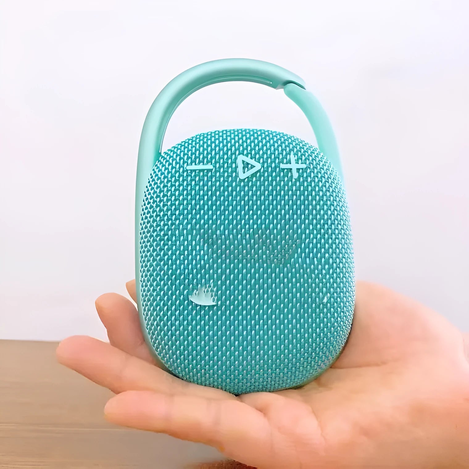 Compact portable Bluetooth wireless speaker in one of six colour options: black, blue, green, pink, red, or silver grey.