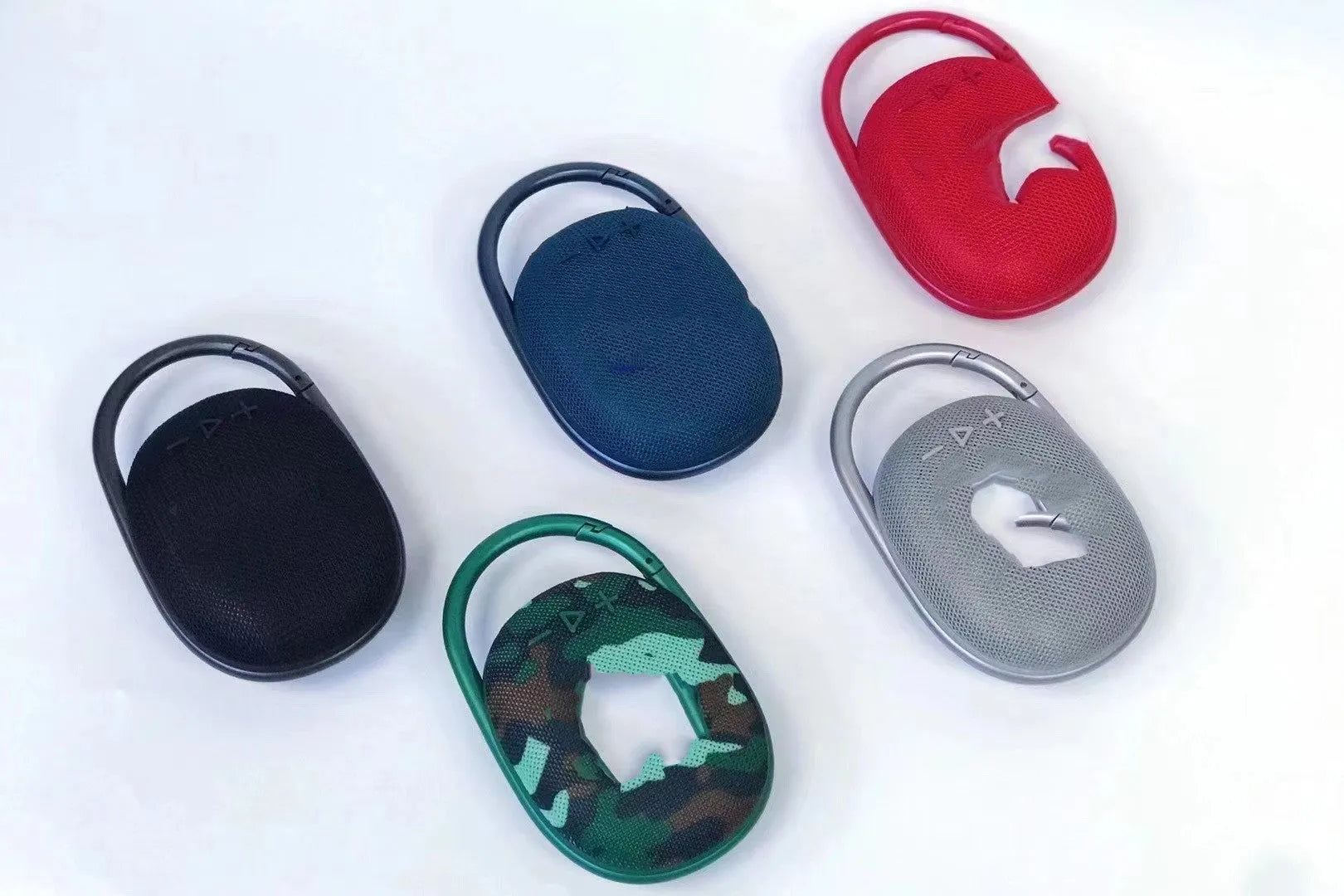 Compact portable Bluetooth wireless speaker in one of six colour options: black, blue, green, pink, red, or silver grey.