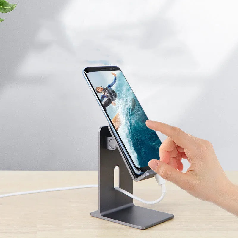 Dark Space Grey zinc alloy mobile phone holder with adjustable lazy bracket arm holding a smartphone on a desk.