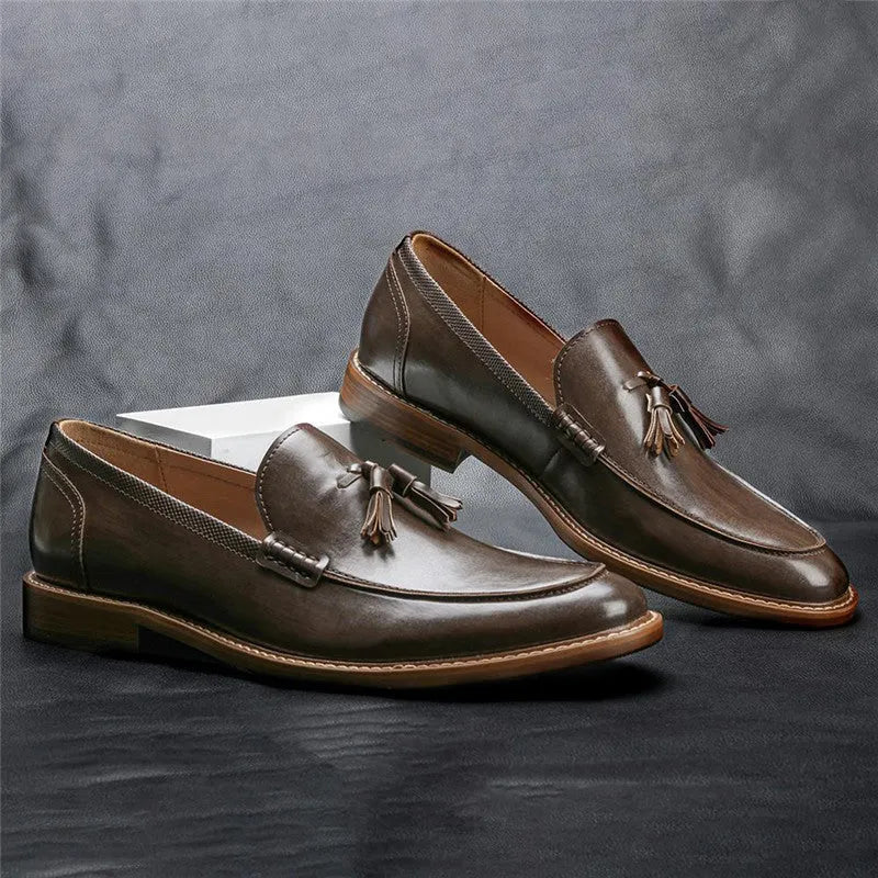 Men's brown formal leather loafers with tassels, PU upper, composite sole, low-cut round toe design on a clean background